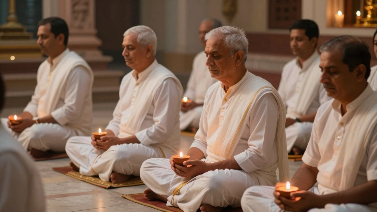 Jain devotees in white meditating peacefully with lamps in a softly lit temple hall